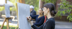 A first-year RISD student is drawing outside as part of their Experimental and Foundation Studies (EFS) program.
